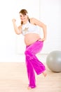 Beautiful pregnant woman doing fitness exercises Royalty Free Stock Photo