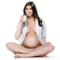 Beautiful pregnant woman drinking milk Royalty Free Stock Photo