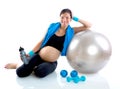 Beautiful pregnant woman at fitness gym relaxed Royalty Free Stock Photo