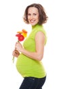 Beautiful pregnant woman with flowers Royalty Free Stock Photo