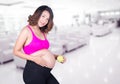 Beautiful pregnant woman with green apple in hospital Royalty Free Stock Photo