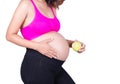 Beautiful pregnant woman with green apple isolated on white Royalty Free Stock Photo