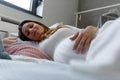 Beautiful pregnant woman having a day nap at home in the bed Royalty Free Stock Photo