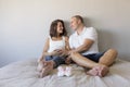 Beautiful pregnant woman and her handsome husband are hugging and smiling while spending time together. Love and couple lifestyle Royalty Free Stock Photo