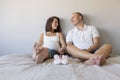 Beautiful pregnant woman and her handsome husband are hugging and smiling while spending time together. Love and couple lifestyle Royalty Free Stock Photo