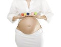 Beautiful Pregnant Woman Holding Baby Blocks