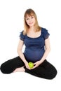 Beautiful pregnant woman holding green apple Royalty Free Stock Photo