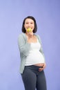 Beautiful pregnant woman holding green apple isolated on lilac Royalty Free Stock Photo