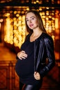 Beautiful pregnant woman in leather jacket Royalty Free Stock Photo