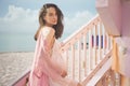 Beautiful pregnant woman on the lifeguard tower