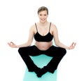 Beautiful pregnant woman in lotus pose Royalty Free Stock Photo