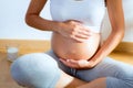 Beautiful pregnant woman massage her belly Royalty Free Stock Photo