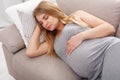 Beautiful pregnant woman napping on sofa Royalty Free Stock Photo