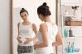 Beautiful pregnant woman near mirror in morning Royalty Free Stock Photo