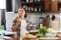 Beautiful pregnant woman preparing healthy meal with lots of vegetables at home Royalty Free Stock Photo