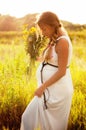 Beautiful pregnant woman relaxing in the park Royalty Free Stock Photo