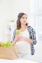 Beautiful pregnant woman with a shopping bag Royalty Free Stock Photo