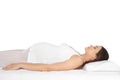 Beautiful pregnant woman sleeping with orthopedic pillow on bed