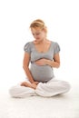 Beautiful pregnant woman thinking of her baby Royalty Free Stock Photo