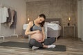 Pregnant woman taking a break from workout