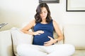 Pregnant Woman Touching Belly To Show Love For Unborn Baby Royalty Free Stock Photo