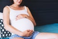 Beautiful pregnant woman waiting of a baby. Royalty Free Stock Photo