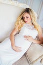 Beautiful pregnant woman in waiting for the baby. Pregnancy. Care, tenderness, maternity, childbirth. Royalty Free Stock Photo