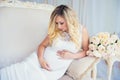 Beautiful pregnant woman in waiting for the baby. Pregnancy. Care, tenderness, maternity, childbirth. Royalty Free Stock Photo