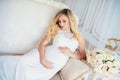 Beautiful pregnant woman in waiting for the baby. Pregnancy. Care, tenderness, maternity, childbirth. Royalty Free Stock Photo