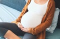 Beautiful pregnant woman waiting of a baby. Royalty Free Stock Photo