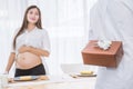 Surprise present for pregnant woman Royalty Free Stock Photo