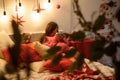 Beautiful pregnant young woman on a Christmas, having a rest on Christmas holidays. Big pregnant belly Royalty Free Stock Photo