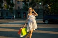 Beautiful pregnant young woman holding shopping bags Royalty Free Stock Photo