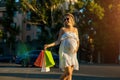 Beautiful pregnant young woman holding shopping bags Royalty Free Stock Photo