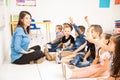 Teacher and students having fun at school