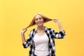 Beautiful pretty charming young blonde woman smiling happily, having fun indoors, playing with long straight hair Royalty Free Stock Photo