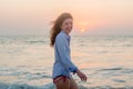 Beautiful pretty sexy red hair woman laughing on the beach during sunset time Royalty Free Stock Photo