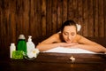 Beautiful pretty young woman laying in spa salon with closed eyes and relaxed Royalty Free Stock Photo