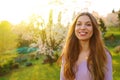 Beautiful pretty young woman walking in park