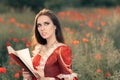 Beautiful Princess Reading a Book in Summer Floral Landscape Royalty Free Stock Photo