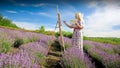 Beautiful professional artist painting lavender field at morning