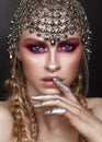 Beautiful with professional color makeup and accessory from hauberk on the head