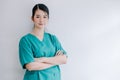 The beautiful professional nurse standing with her arms crossed and looking straight at the camera with a happy smiling Royalty Free Stock Photo