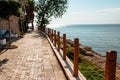 beautiful promenade of the city of Side fence with wooden posts along which palm trees grow. five-star concept Royalty Free Stock Photo