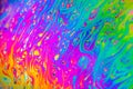 Beautiful psychedelic abstraction formed by light on the surface of a soap bubble