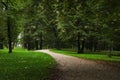 Beautiful public city park with pathway and green grass Royalty Free Stock Photo