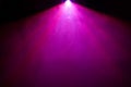 Beautiful purple color wide lens projector with light beam for movie and cinema at night . smoke texture spotlight . effects Royalty Free Stock Photo