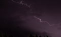 Beautiful purple lightning in the night sky. Royalty Free Stock Photo