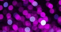 Beautiful Purple lilac Bokeh Background. Decorative Holiday Texture. Backdrop for design. Blurred Festive street light on black