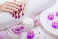 Beautiful purple manicure with spa essentials Royalty Free Stock Photo